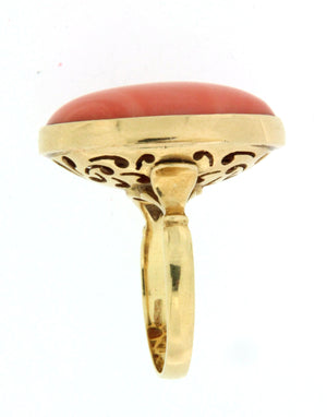 Anello in oro 18 kt con spola di corallo