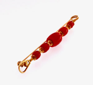 Spilla in oro 18 kt. con coralli