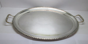 Vassoio in argento 800 di forma ovale con bordo e manici lavorati usato