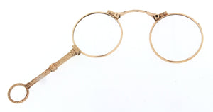Occhialino pieghevole, lorgnette d'epoca, metà '800, con cornice, maniglia decorativa e anello di base in oro 18 kt. Lenti per lettura.