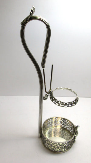 Porta bottiglia da tavola in argento 800 Peso totale gr.403,00 Misure: altezza cm.38,00 diametro base cm.9,50  Usato